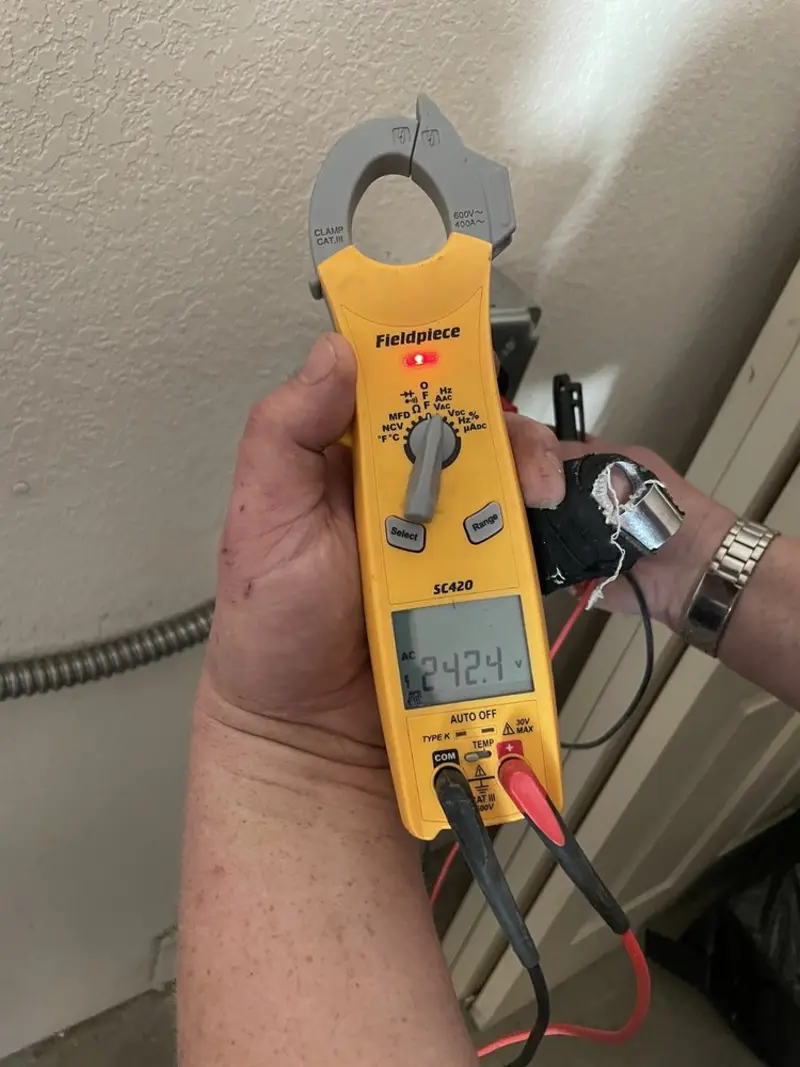 Voltage testing with clamp meter during Electrical Installation Services in Hickory Hills